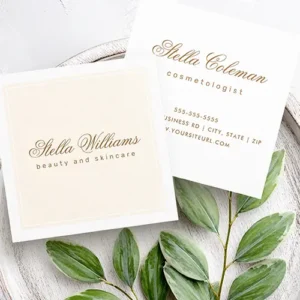 Customizable square business cards. The front has a framed center panel with beautiful calligraphic script text above a clean sans-serif line in brown ink. The back has plain white background with the same calligraphic and sans-serif text stack at the top, and a detailed, vertically-separated contact info block at the bottom.