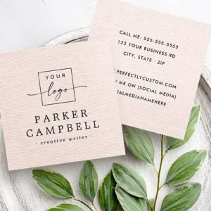 A modern square calling card with a faux-texture printed pink linen background. The design includes custom logo branding on the front and contact details on the back against the textured background.