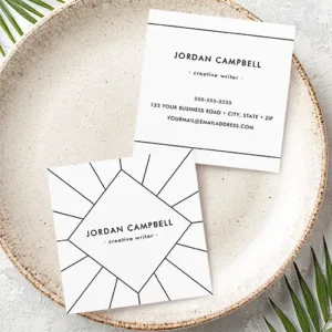 Front and back view of a square business card. The front features a minimalist geometric starburst pattern in black lines on white with a centered custom name and title. The back view is clean white with black text centered, repeating the name and title at the top, followed by phone, address, and email details between thin horizontal black lines.