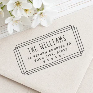 Custom self-inking stamp design featuring multiple overlapping hand-drawn rectangular borders framing an uppercase family name above three lines of clean address text and a spaced dashed ZIP code row.