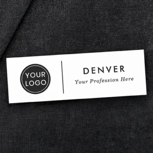 Rectangular white plastic name tag displaying a left-aligned custom logo, a thin vertical divider bar, stacked uppercase employee name text, and an italic job title subline.