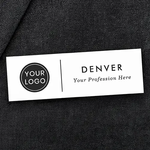 Rectangular white plastic name tag displaying a left-aligned custom logo, a thin vertical divider bar, stacked uppercase employee name text, and an italic job title subline.