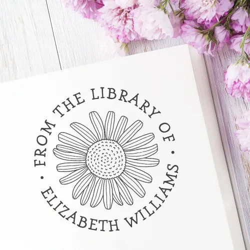 Circular floral library bookplate stamp with hand-drawn daisy illustration and customizable name and “From the Library Of” text.