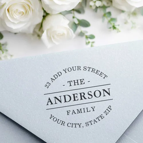 Custom family return address stamp with customizable name, street, city, and ZIP. Elegant serif text and classic curved layout for envelopes and stationery.