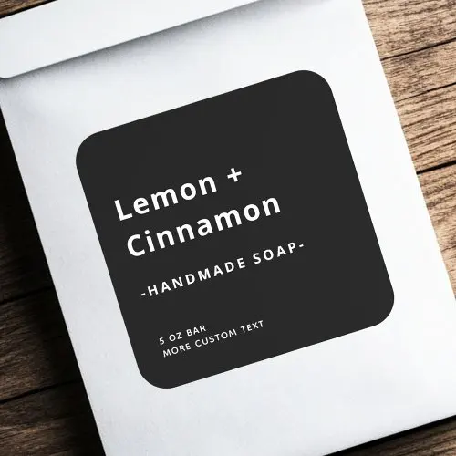 Customizable black square product label with bold white sans-serif text, minimalist layout, and rounded corners for modern branding.