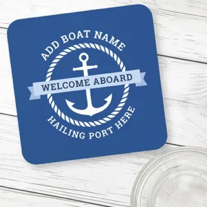 Square blue plastic coaster with rounded corners showing a white anchor enclosed in a rope frame, a light blue Welcome Aboard banner, and custom curved text.