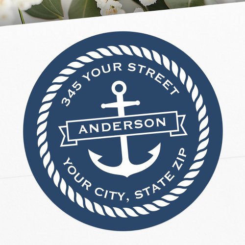 Round navy blue nautical anchor return address label with white rope border, customizable with family name and address.