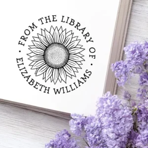 Personalized self-inking library stamp with hand drawn sunflower illustration and custom name around the design.
