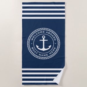 Dark blue welcome aboard beach towel with your boat named hailing port around an anchor design