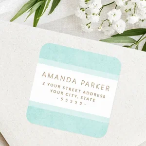 Square address sticker featuring top and bottom aqua blue textured borders, a white center stripe, and golden-brown sans-serif typography.