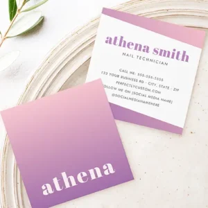 Front and back view of a square business card. The front features a vertical pastel pink to lavender purple gradient with white serif name text near the bottom. The back has a white background with angled pink and purple gradient header/footer bands, custom purple name typography, and organized contact information text.
