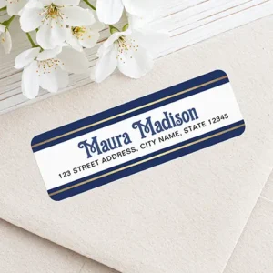 Rectangular address sticker featuring top and bottom dark navy blue borders with printed color gold gradient accent stripes framing a white center panel containing blue festive name text and dark address block lettering.