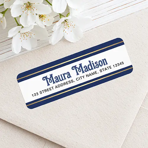 Rectangular address sticker featuring top and bottom dark navy blue borders with printed color gold gradient accent stripes framing a white center panel containing blue festive name text and dark address block lettering.