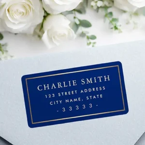Rectangular address sticker featuring a deep dark navy blue background framed by a faux metallic printed golden gradient inner border with centered serif name and address typography.