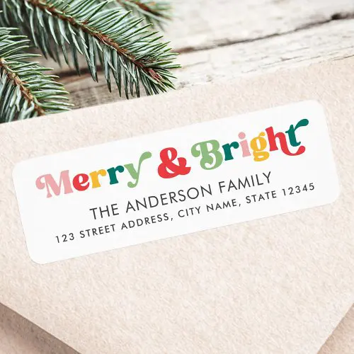 Return address label with colorful “Merry & Bright” heading in retro decorative lettering, clean customizable family name, and address on a white background with rounded corners.