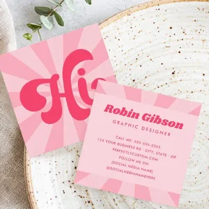 Front and back square business cards. The front card shows a light pink and darker pink starburst pattern with a large fuchsia stylized groovy script reading "Hi". The back card displays organized fuchsia text placeholders for name, title, contact, and social media handles within a central pink column bordered by the sunburst frame.