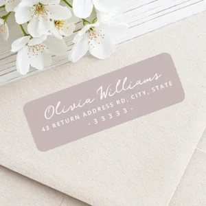 Rectangular address sticker featuring a soft dusty rose taupe background with a white brush handwritten style cursive script name and centered white block address text.