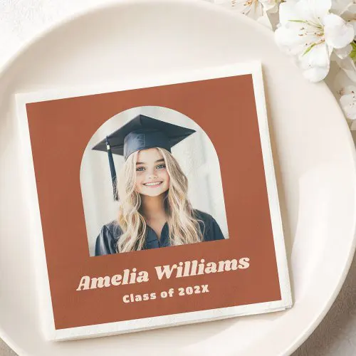 Modern terracotta graduation napkin with arch photo frame and custom text for name and class year. Elegant and personalized party napkin design.
