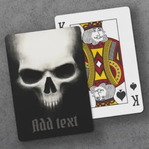 A custom playing card featuring a gritty illustration of a threatening skull emerging from darkness, with a customizable Olde English text field at the bottom.