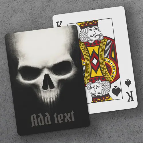 A custom playing card featuring a gritty illustration of a threatening skull emerging from darkness, with a customizable Olde English text field at the bottom.