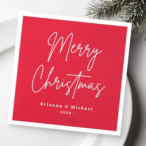 Red Merry Christmas napkins with modern handwritten script and custom names and date