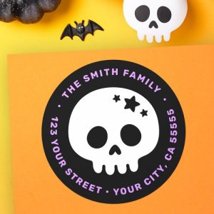 Round skull return address label with stars, customizable with name and address in purple text.