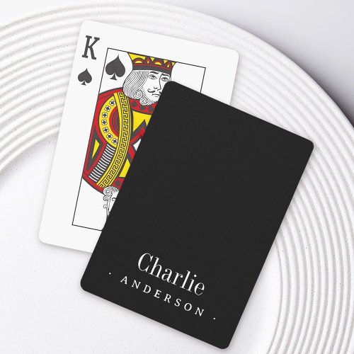 Custom black playing cards with personalized name in white text, modern elegant design.