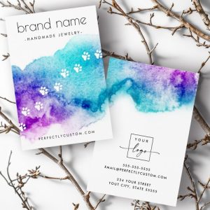 Pet paw prints over blue and purple watercolor wash, Earring display card for dog or cat themed designs