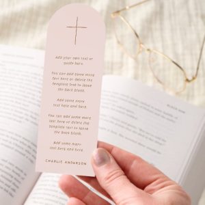 Personalized Christian bookmark with cross design and customizable text on a blush pink background.
