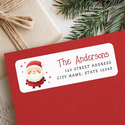 Watercolor Santa Claus return address label featuring a cute Santa in red suit with white trim, smiling face, and red stars on a white background. Customizable family name in red script and address in black whimsical typewriter-style font. Perfect for Christmas cards, holiday invitations, and festive mail.