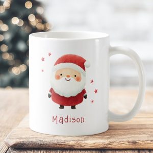 Personalized Christmas ceramic mug with watercolor Santa illustration, red stars, and custom name text. Cute holiday coffee cup gift for kids and adults.
