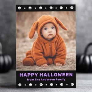 Personalized Halloween card with black background, purple “Happy Halloween” text, skull and star border, and one customizable photo placeholder.
