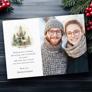 Personalized Christmas photo card with watercolor deer and pine trees on the left and a full-bleed family photo on the right; editable greeting and names.
