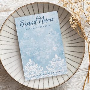 Personalized earring card with blue damask pattern design, customizable logo and text.