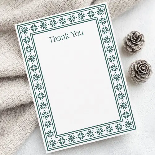 White thank you card with green Scandinavian folk pattern border and geometric Nordic star frame design.