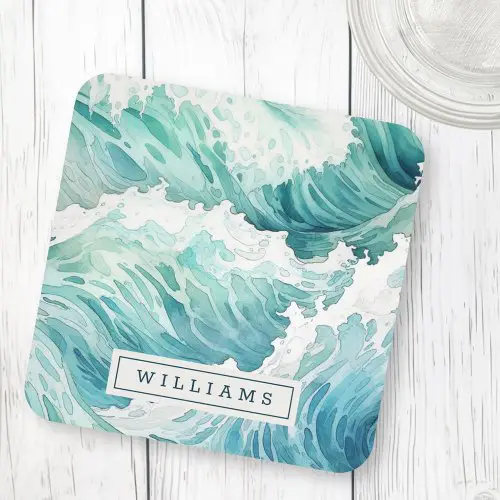 A square hard plastic coaster featuring blue and green watercolor ocean waves and white sea foam. A rectangular box at the bottom center contains your custom name.