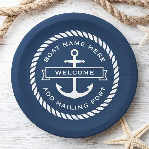 A round navy blue paper plate featuring a white central anchor, a rope-themed border, and customizable text for boat names and hailing ports.
