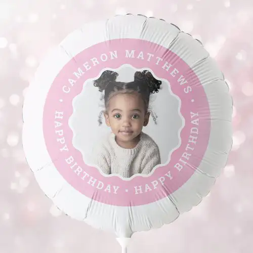 a personalized white round helium balloon. It features a central custom photo surrounded by a pink circular border with white custom text.