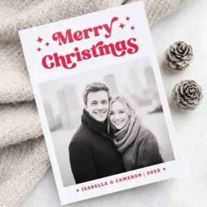 A vertical Christmas card featuring your custom photo. Above the photo is bold red 70s-style 'Merry Christmas' text with star icons. Below is personalized name text.