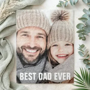 A jigsaw puzzle with custom photograph and the text 'BEST DAD EVER' printed in bold white letters. Perfect as a personalized gift.