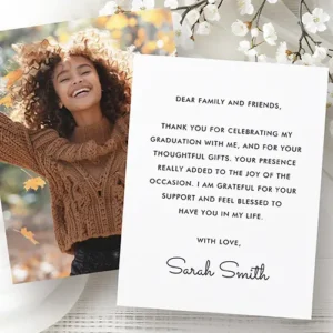 A double-sided flat graduation stationery card. The front side showcases a full-bleed vertical custom photo template that completely fills the layout out to its borderless edges. The reverse side features a minimalist, solid white background with a centered block of black, capitalized sans-serif text for a personalized message, rounded out at the bottom with an editable custom signature template written in a delicate flowing cursive script.