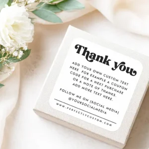 A custom business label with a minimalist black-on-white design. The layout includes a stylish "Thank You" header, a central block for personalized messages or coupon codes, and a professional footer for social media links and website information.