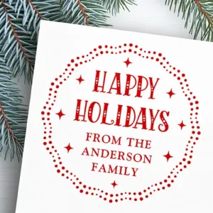 An ink rubber stamp featuring a circular wavy scalloped border made of double rows of dots, containing central text reading Happy Holidays in a dotted serif font above custom family name lines and four-point starburst symbols.