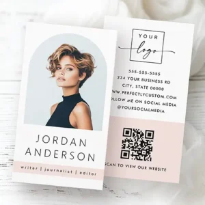 Arch photo modern minimal light blush pink QR logo Business Card Two-sided vertical business card design showing an arched custom photo headshot frame on the front and a QR code with contact information on a blush pink background on the back.