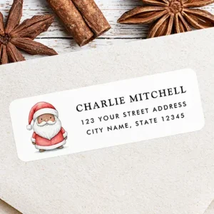 Cute watercolor Santa Claus return address label sticker. Rectangular white return address sticker featuring a storybook watercolor illustration of a cute little Santa Claus character on the left alongside custom black name and address text lines on the right.