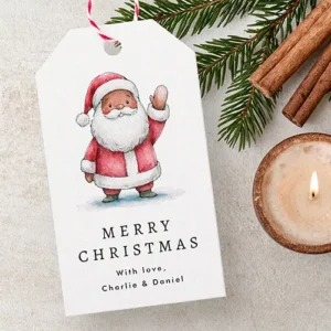 Cute Black Santa Claus Christmas gift tag with solid red backing Double-sided paper gift tag showing a watercolor Black Santa Claus waving in a red suit above black "Merry Christmas" script on the front, with a solid vibrant red reverse side.