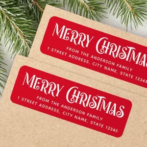 Red & white festive Merry Christmas return address Label Rectangular red adhesive return address label featuring large, vintage style, white decorative "Merry Christmas" typography with ornamental swirls above custom family name and address text lines.