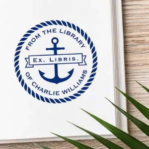 Custom Ex Libris ship anchor book stamp with custom name A circular rubber stamp design featuring a central anchor icon with an Ex Libris banner, framed by a twisted rope ring and curved text reading From The Library Of and your custom name.